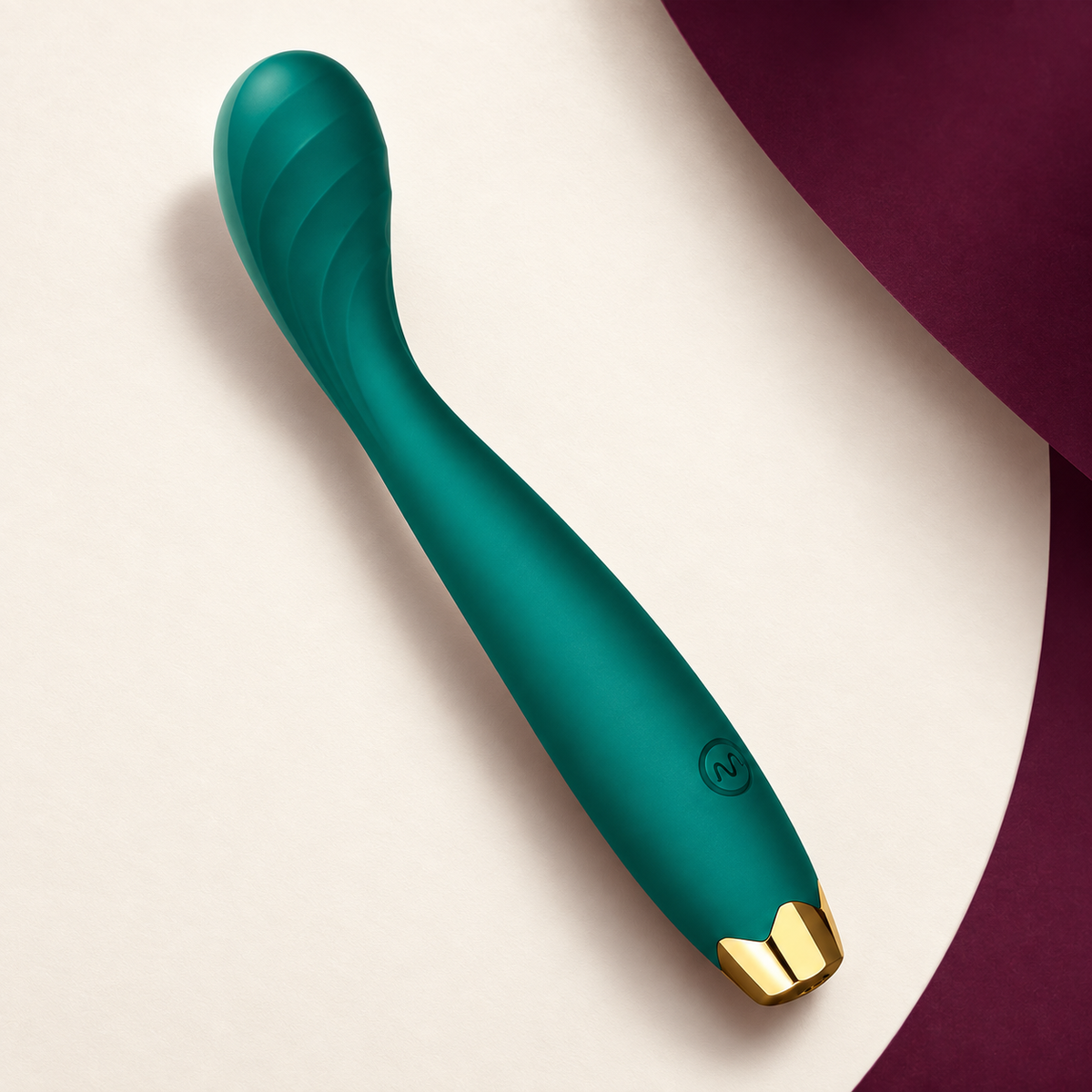 Green curved personal massager with gold end cap — KINKZA ivory product view